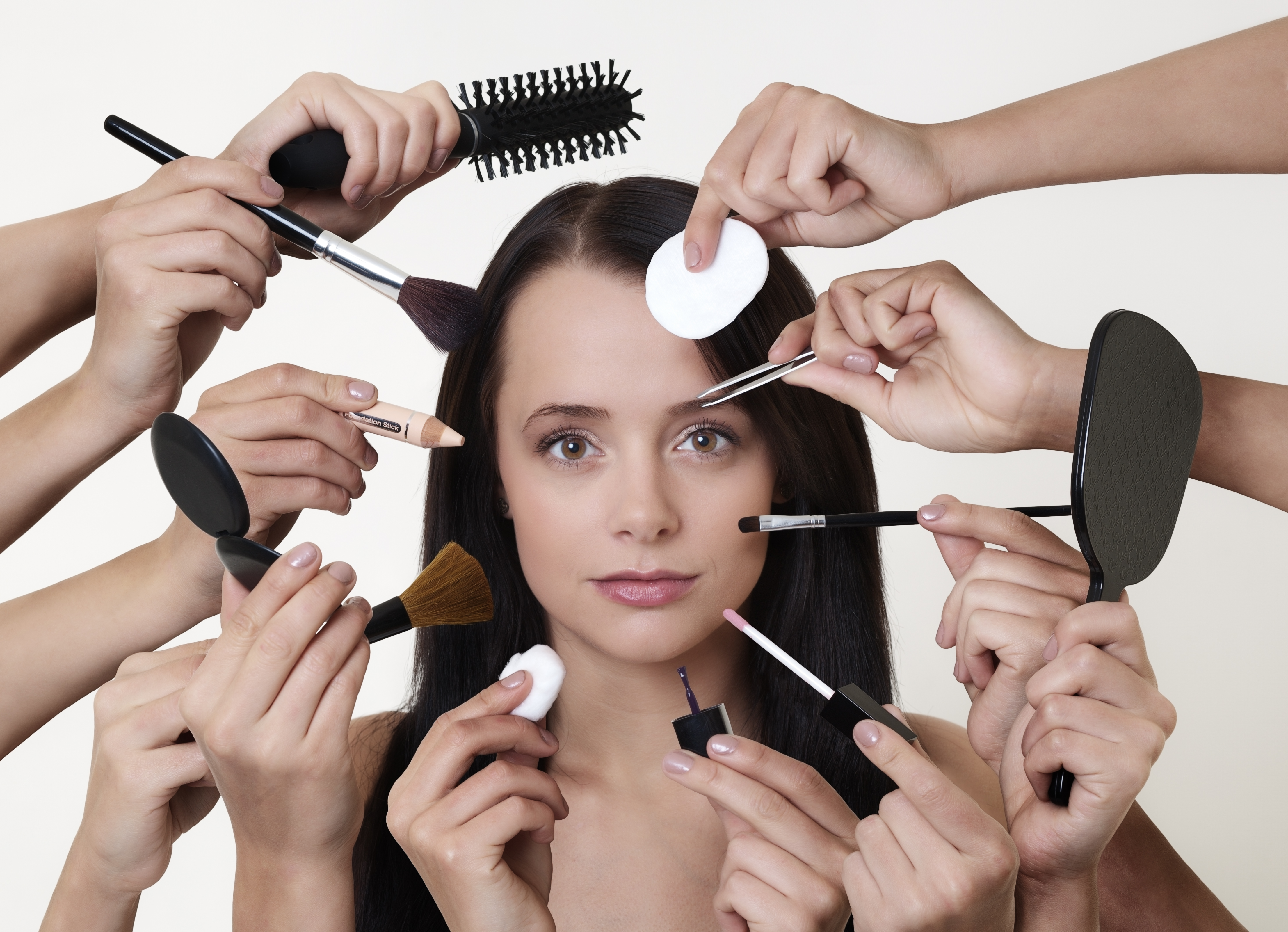woman doing make up with many hands and arms helping her get the job done faster